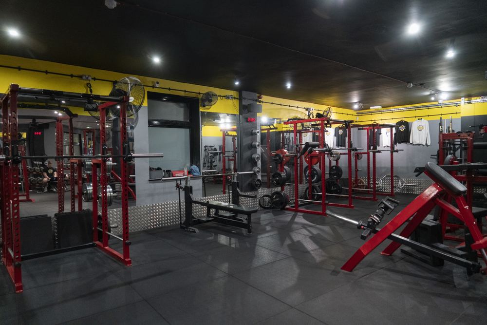 Rebel Gym squat racks and bench press area