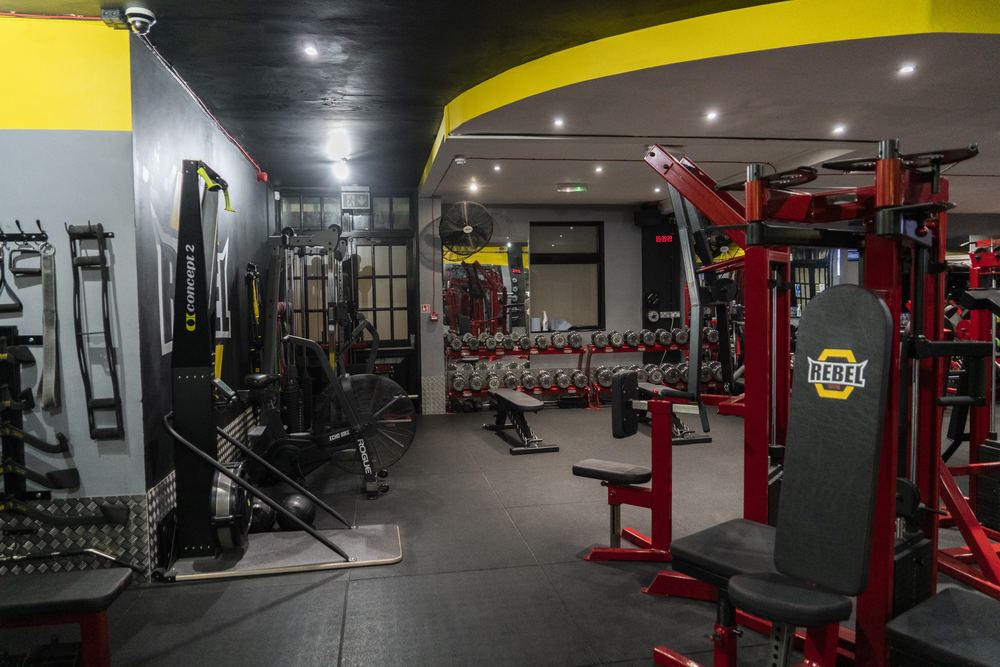 Rebel Gym functional training area with bikes and rower