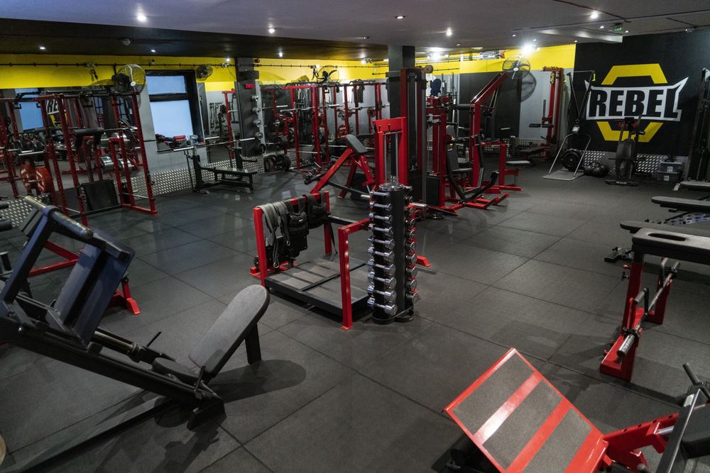 Rebel Gym dumbbell rack and branded wall